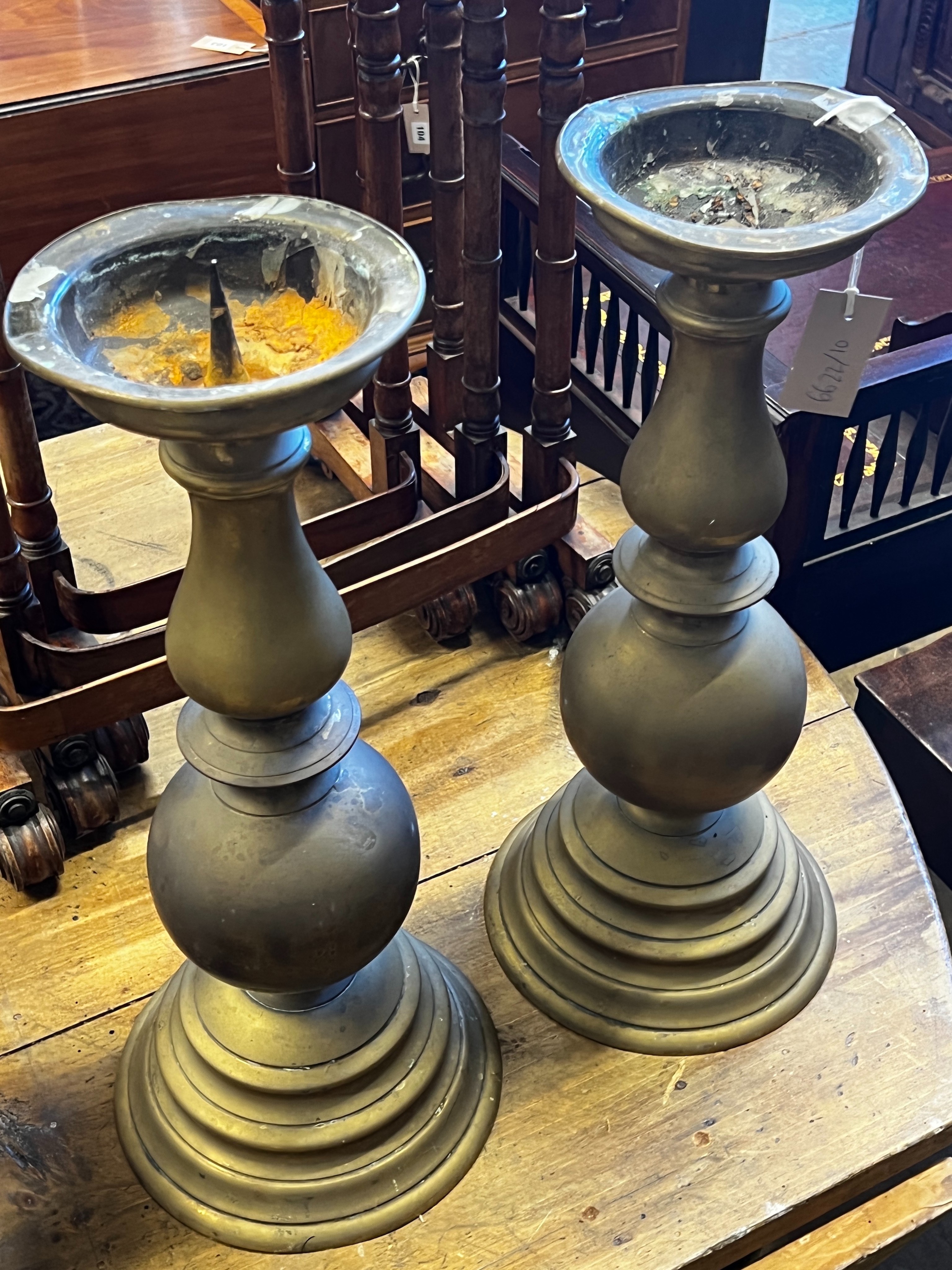 A pair of Victorian style brass pricket candlesticks, height 50cm